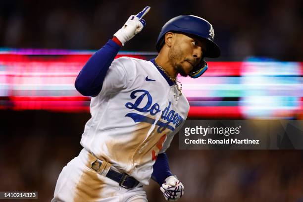 Mookie Betts of the Los Angeles Dodgers celebrates a three-run home run against the San Francisco Giants in the eighth inning at Dodger Stadium on...