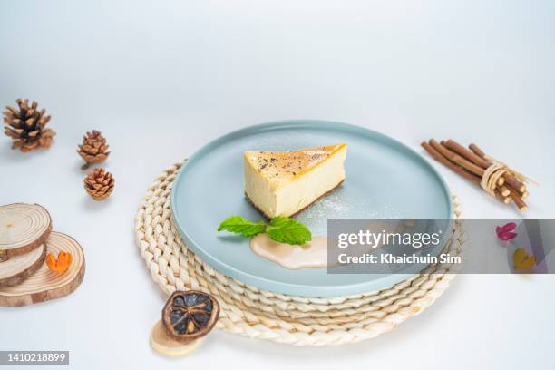 slice of cheese cake with white background - slice of cake isolated stock pictures, royalty-free photos & images