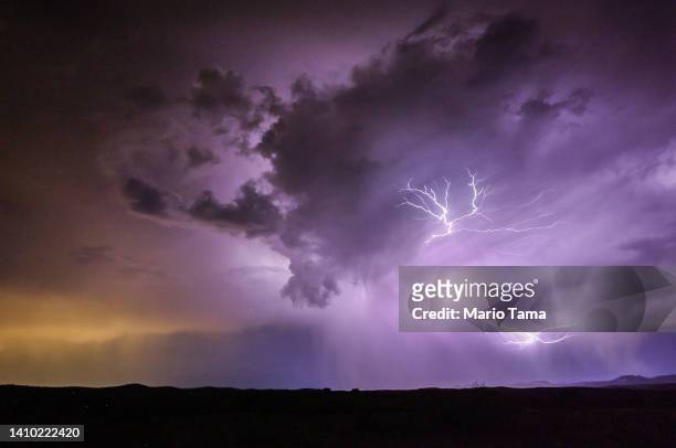 Lightning strikes during a monsoon storm on July 21, 2022 near Mayer, Arizona. The National Weather Service issued an excessive heat warning for...