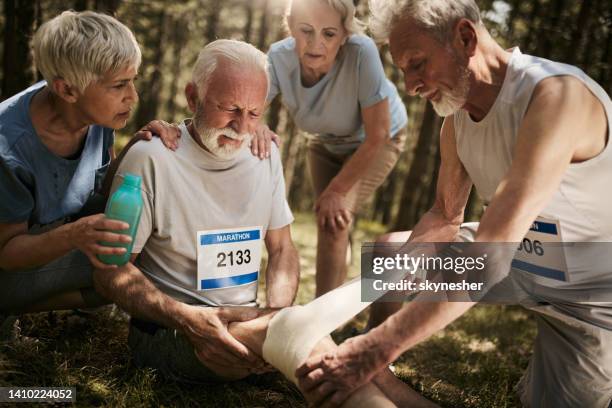 let us help you with that injured knee! - injured knee stock pictures, royalty-free photos & images