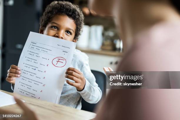 i've got an f on my test! - child report card stock pictures, royalty-free photos & images