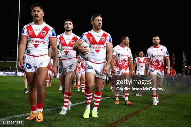 Ben Hunt of the Dragons and team mates leave the field following warm up during the round 19 NRL match between the St George Illawarra Dragons and...