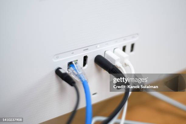 computer cables plugged with usb port - man and machine stock pictures, royalty-free photos & images