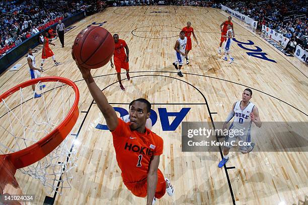 Robert Brown of the Virginia Tech Hokies drives for a shot attempt against the Duke Blue Devils in their Quarterfinal game of the 2012 ACC Men's...