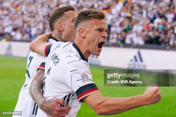 Joshua Kimmich of Germany celebrates with David Raum of Germany after scoring his sides first goal during the UEFA Nations League match between...