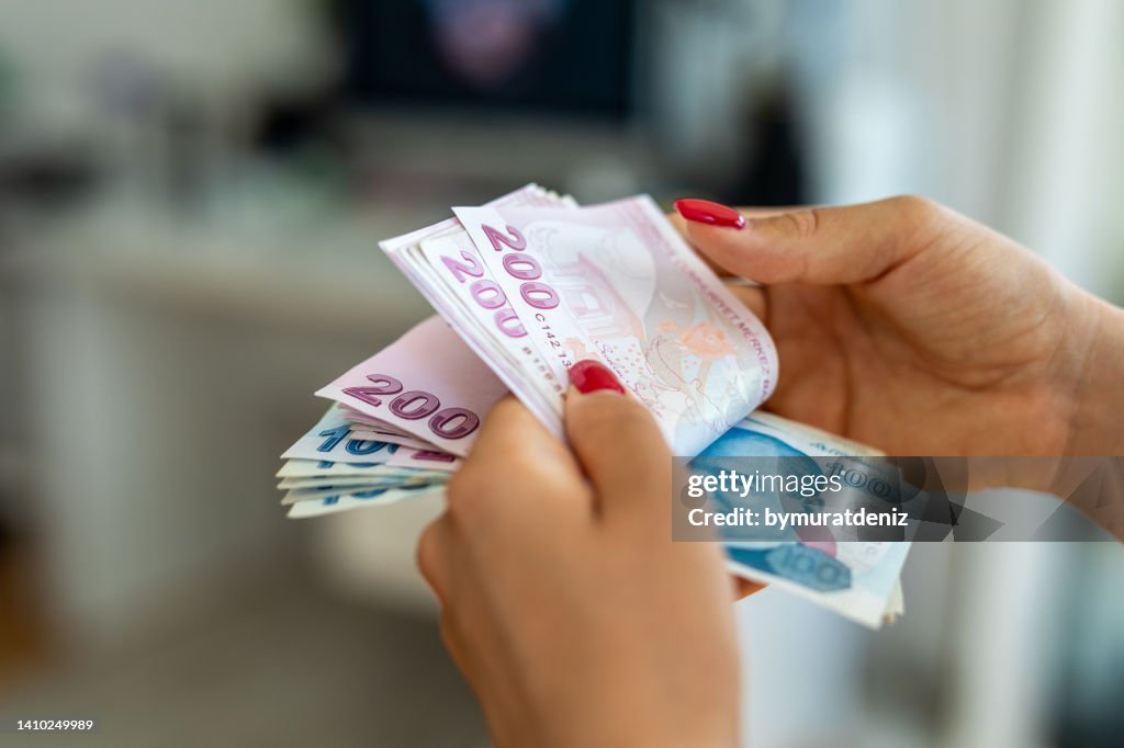 Female hand counting Turkish Lira