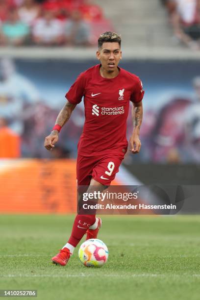 Roberto Firmino of Liverpool runs with the ball during the pre-season friendly match between RB Leipzig and Liverpool FC at Red Bull Arena on July...