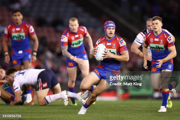 Kalyn Ponga of the Knights runs the ball during the round 19 NRL match between the Newcastle Knights and the Sydney Roosters at McDonald Jones...