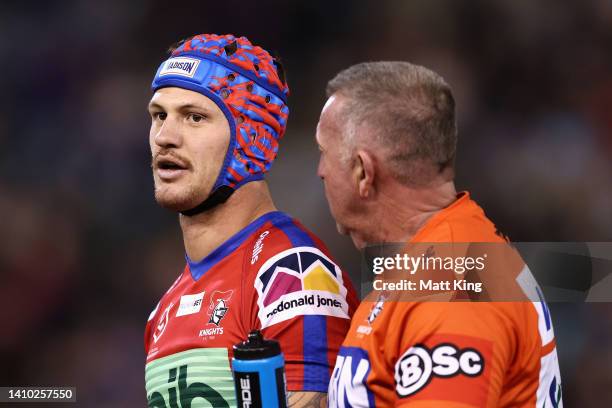 Kalyn Ponga of the Knights receives attention after being tackled high by Matthew Lodge of the Roosters during the round 19 NRL match between the...