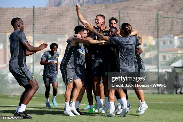 Theo Corbeanu, Joe Hodge, Leander Dendoncker, Pedro Neto, Yerson Mosquera, Ruben Neves and Daniel Podence celebrate during a Wolverhampton Wanderers...