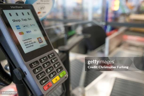 Contactless chip and pin terminal at the checkout at the new Tarleton Aldi store on July 22, 2022 in Tarleton, United Kingdom. Aldi is the UK’s fifth...