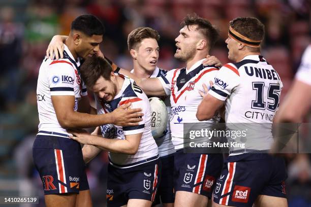 Daniel Tupou of the Roosters celebrates scoring a try with Luke Keary of the Roosters and team mates during the round 19 NRL match between the...