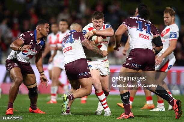 Blake Lawrie of the Dragons is tackled during the round 19 NRL match between the St George Illawarra Dragons and the Manly Sea Eagles at Netstrata...