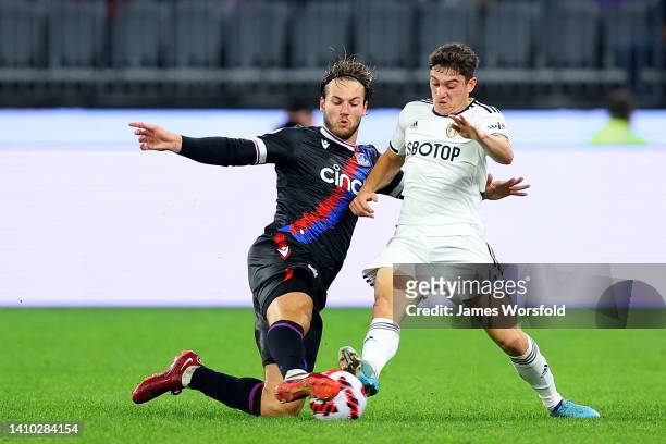 Joachim Andersen of Crystal Palace slides in to tackle Daniel James of Leeds United during the Pre-Season friendly match between Leeds United and...