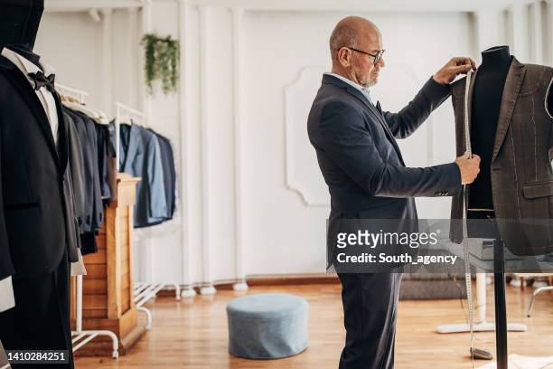tailor making a suit - bespoke stock pictures, royalty-free photos & images