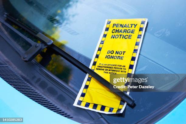 parking ticket on windscreen - parking sign stock pictures, royalty-free photos & images