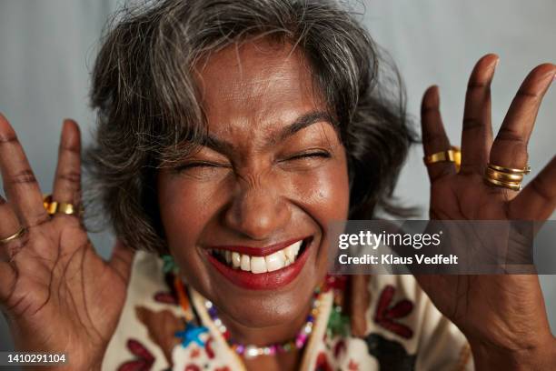 happy woman with eyes closed - hand gag foto e immagini stock