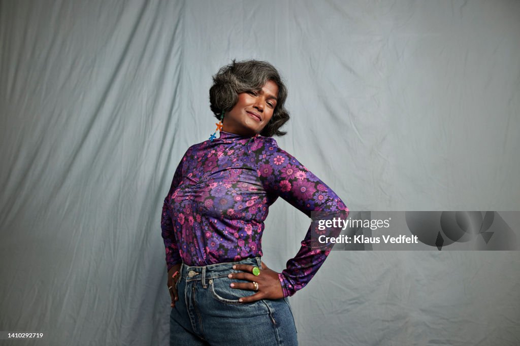 Confident woman with hands on hips