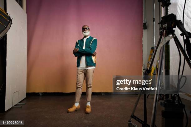 confident senior man with arms crossed in photo studio - confidence portrait stock pictures, royalty-free photos & images