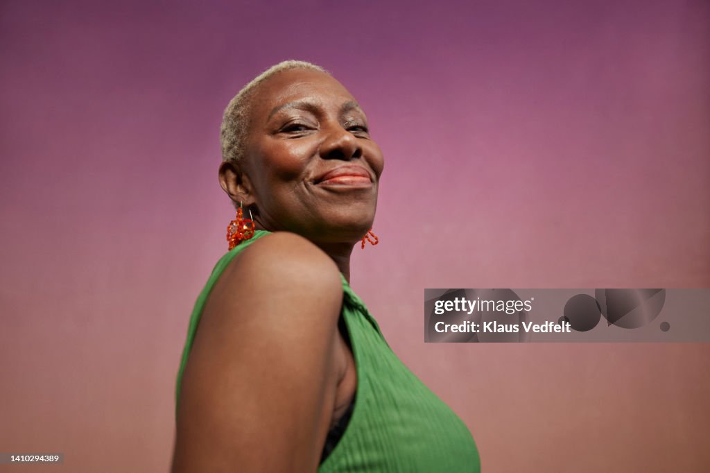 Portrait of smiling modern senior woman