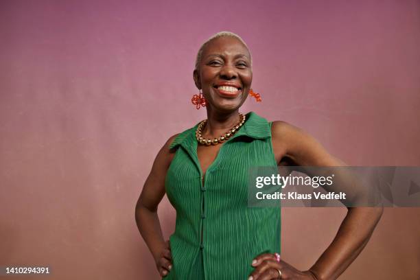portrait of elderly chic woman with hands on hips - beautiful older black women stock pictures, royalty-free photos & images