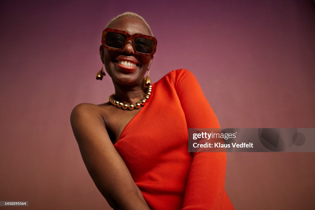 Portrait of elderly hipster woman wearing sunglasses