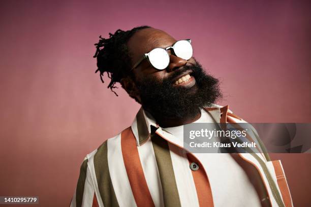 smiling mature man wearing sunglasses - suave stock pictures, royalty-free photos & images