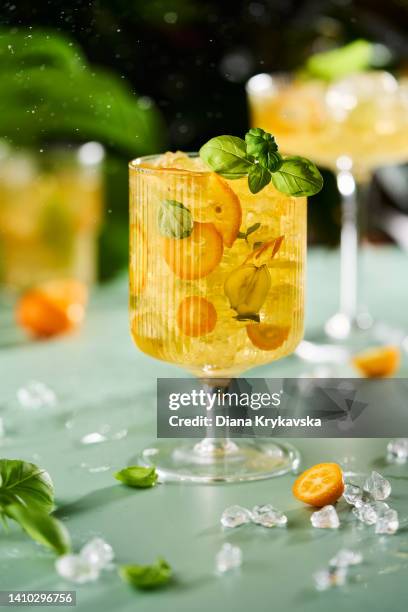 tropical cocktail with kumquat - tropical fruit stock pictures, royalty-free photos & images