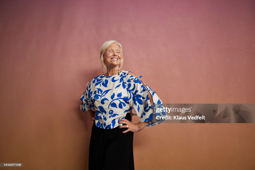 Happy senior woman with eyes closed