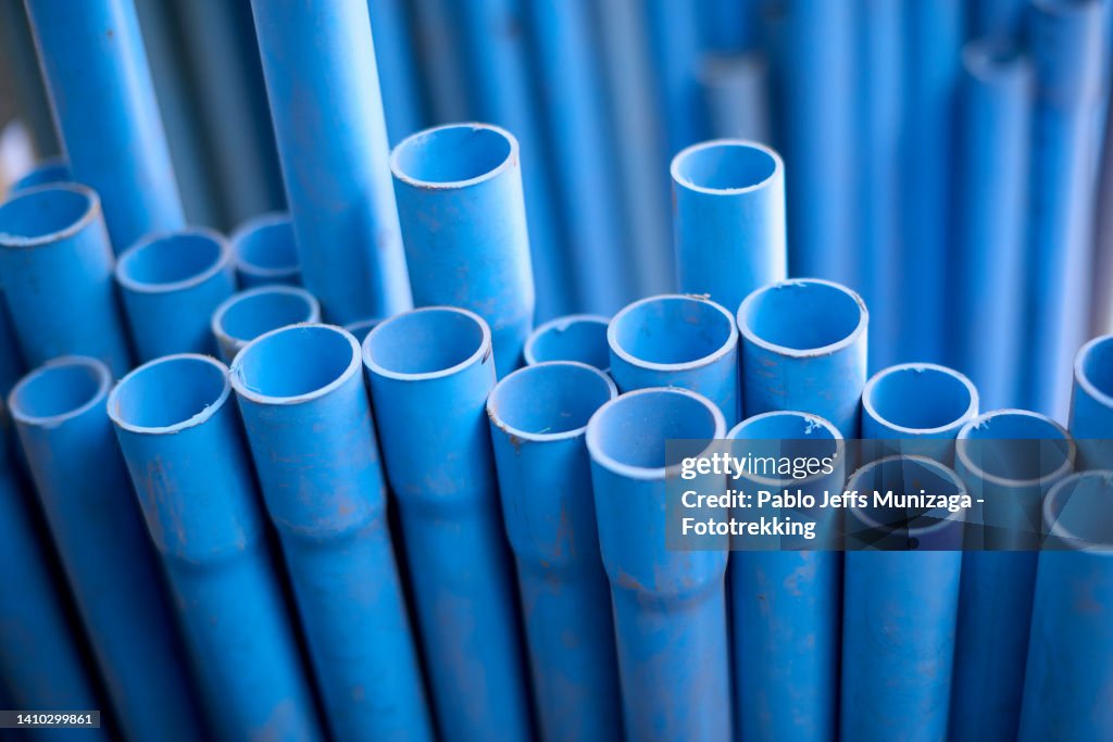Stack Of Pvc Blue Pipes High-Res Stock Photo - Getty Images
