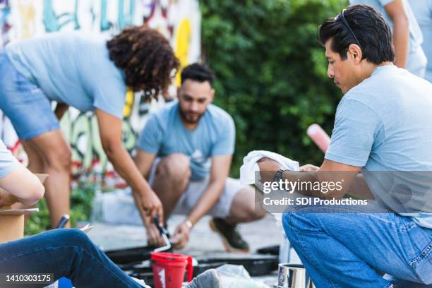 coworkers prepare their supplies - cleaning graffiti stock pictures, royalty-free photos & images