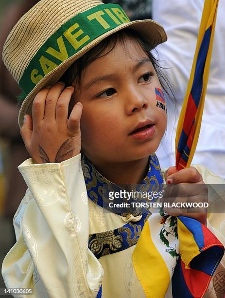 Tenzin, age six, listens to speeches marking the 53rd anniversary of the Tibetan uprising in Sydney on March 10, 2012. Over 150 members of...