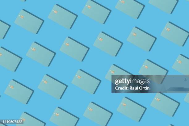 pattern of contactless blue credit card on blue background. - shopping coloured background stock pictures, royalty-free photos & images