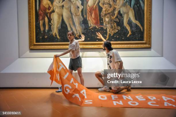 Protestors from the action group Ultima Generazione glue their hands to the glass covering Sandro Botticelli's La Primavera at Uffizi on July 22,...