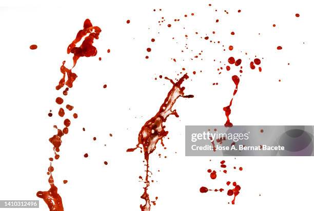 full frame of splashes and drops of red liquid in the form of blood, on a white background. - bloody death stock-fotos und bilder