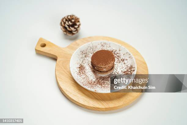 chocolate flavored macaroon with white background - souffle stock pictures, royalty-free photos & images