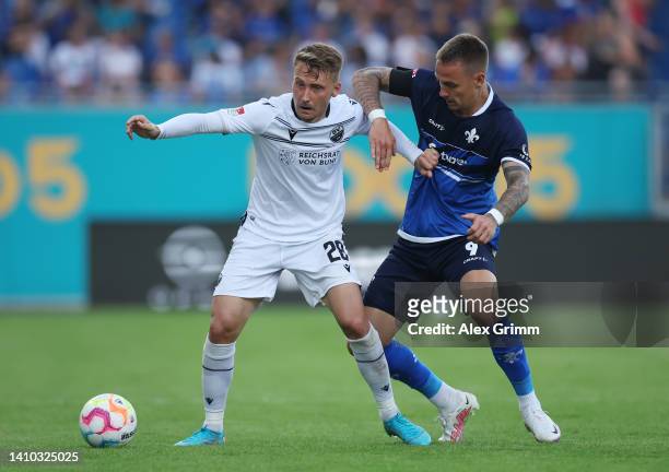 Tom Trybull of Sandhausen is challenged by Philip Tietz of Darmstadt during the Second Bundesliga match between SV Darmstadt 98 and SV Sandhausen at...
