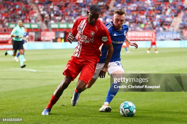 Tobias Mohr of Schalke challenges Joshua Brenet of Enschede during the Pre-Season friendly match between Twente Enschede and FC Schalke 04 at De...