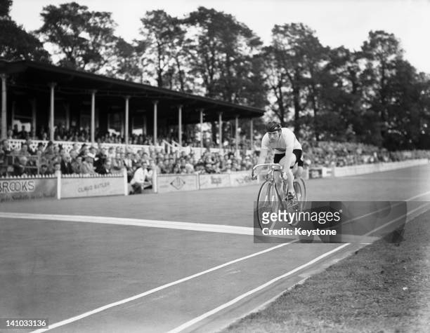 Cyclist Reg Harris of Great Britain wins heat eight of round two in the Men's Sprint at Herne Hill Velodrome during the Olympic Games, London, 7th...