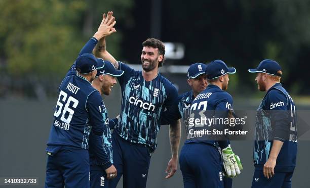 England bowler Reece Topley celebrates after taking the wicket of Rassie van der Dussen during the 2nd ODI between England and South Africa at...