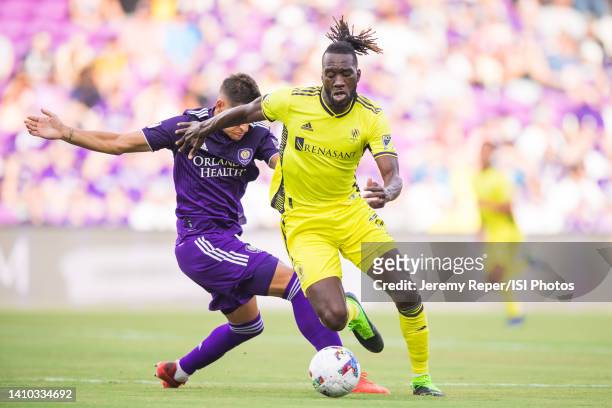 Sapong of Nashville SC dribbles the ball during a U.S. Open Cup game between Nashville SC and Orlando City SC at Exploria Stadium on June 29, 2022 in...