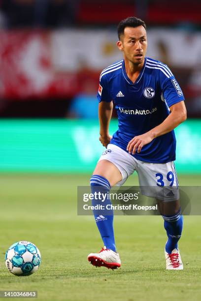 Maya Yoshida of Schalke runs with the ball during the Pre-Season friendly match between Twente Enschede and FC Schalke 04 at De Grolsch Veste Stadium...