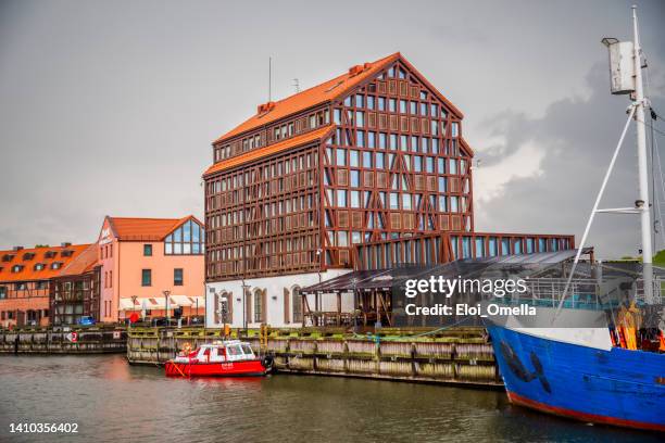 old mill hotel in the harbor of klaipeda, lithuania - vilnius street stock pictures, royalty-free photos & images