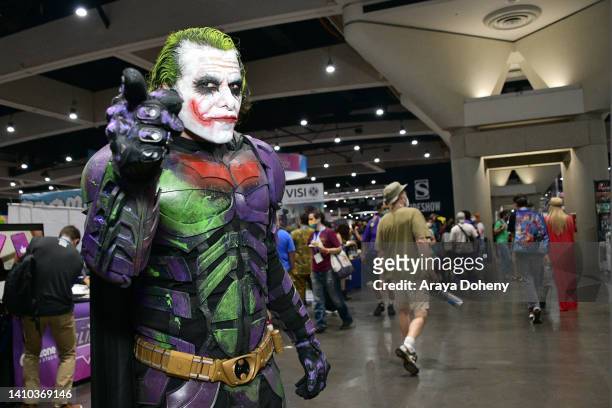 Cosplayer wears a Joker and Batman mashup costume from Batman at the 2022 Comic-Con International: San Diego on July 22, 2022 in San Diego,...