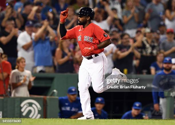 Jackie Bradley Jr. #19 of the Boston Red Sox celebrates after hitting a home run against the Toronto Blue Jays during the fourth inning at Fenway...