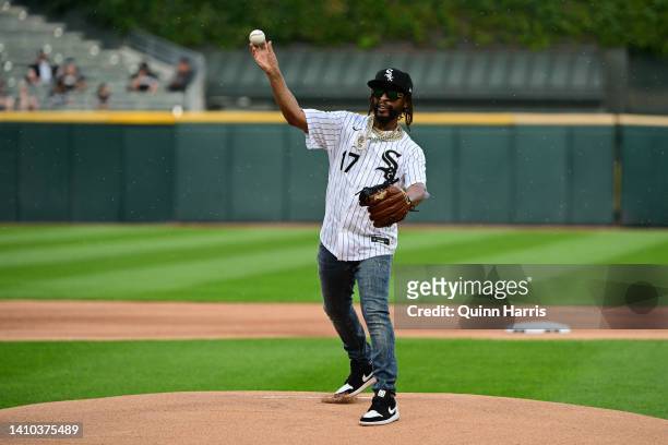 Rapper Jonathan Henry Smith, better known by his stage name Lil Jon, throws a ceremonial first pitch before the game between the Chicago White Sox...