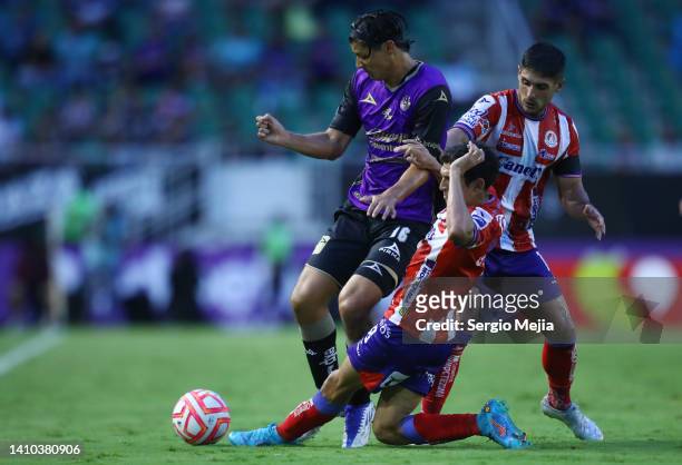 Alfonso Sanchez of Mazatlan and Javier Guemez of San Luis fight for the ball during the 4th round match between Mazatlan FC and Atletico San Luis as...