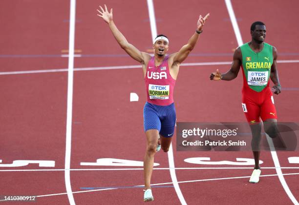 Michael Norman of Team United States and Kirani James of Team Grenada cross the finish line in the Men's 400m Final on day eight of the World...