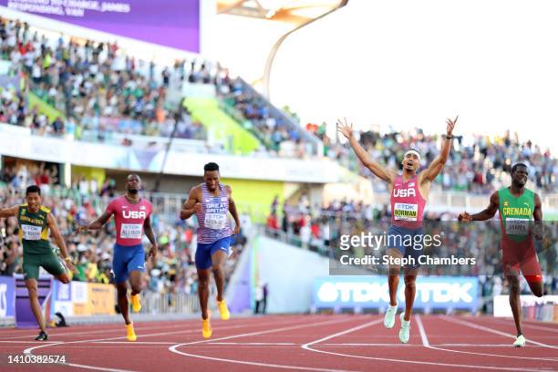 Matthew Hudson-Smith of Team Great Britain, Michael Norman of Team United States and Kirani James of Team Grenada cross the finish line in the Men's...