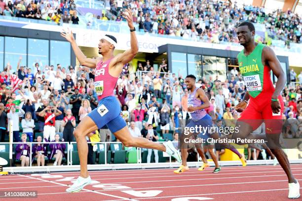 Matthew Hudson-Smith of Team Great Britain, Michael Norman of Team United States and Kirani James of Team Grenada cross the finish line in the Men's...